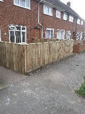 tanallised fencing ,timber posts ,concreted in the ground.