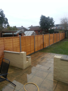 Fencing lap panels,6 inch gravell boards concrete posts.